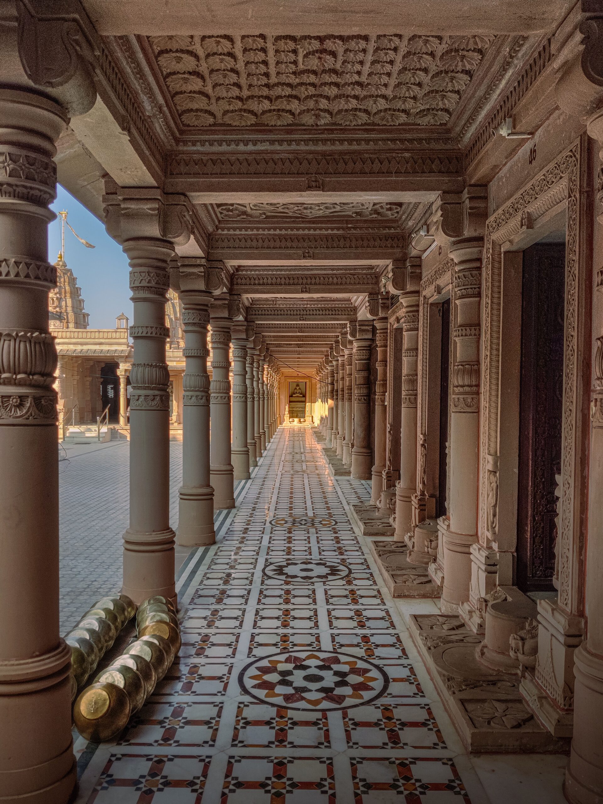 Explore the stunning architectural details of Katraj Jain Temple's colonnade, showcasing artistic craftsmanship.